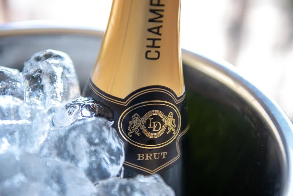 A bottle of champange showing reasons to bring your pet to our dog-friendly campsite