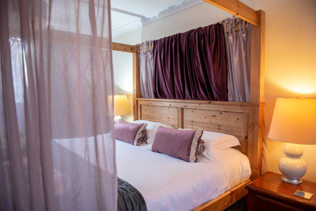 bedroom with lamp on in our YellowTop lodges in York